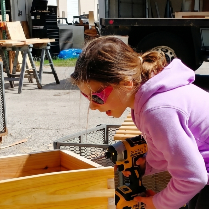 MI-IMPACT-Girl-using-power-drill-building-young-entrepreneur-Detroit-Michigan-alternative-homeschool-online-school-programs